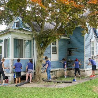 Ash Brokerage Team Painting House with Neighborlink Fort Wayne